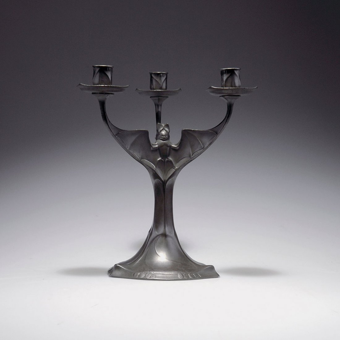 Candelabrum 'Bat', 1901/02: Kayser, Krefeld. 'Bat' candelabrum, 1901/02. H. 30 cm; D. 26.5 cm. Designed by Hugo Leven (attributed). Pewter. Marked: KAYSERZINN 4506.