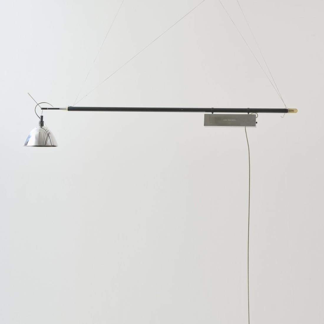 Ingo Maurer and Team, 'Max Mover' hanging light, 2000 (design): H. 16,5 cm, L. 120-198 cm, Ø 16 cm.Design M, Ingo Maurer, Munich.Aluminum sheet, tubular metal, painted black, Fiberglass.Marked: MAX MOVER, manufacturer's stamp, embossed signature Ingo Maurer