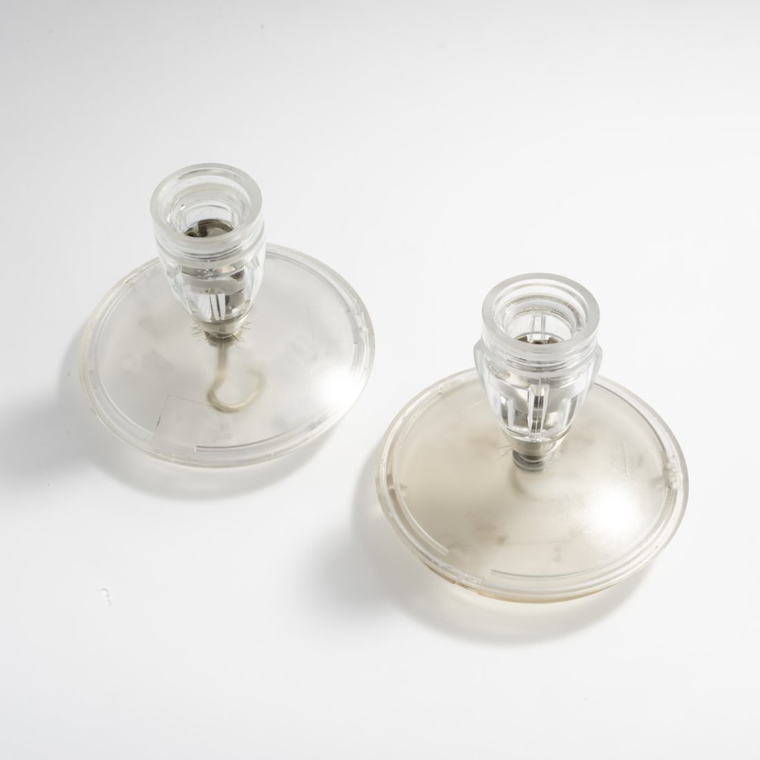 Bernhard Dessecker, Two 'Sista' ceiling lights, 1998 (design): H. 10.5 cm (without bulb), Ø 13 cm. Design M, Ingo Maurer, Munich. Glass, colorless, plastic, colorless. Marked: manufacturer's sticker. Literature: Cat. Ingo Maurer Now, Zorneding n. d, p. 27