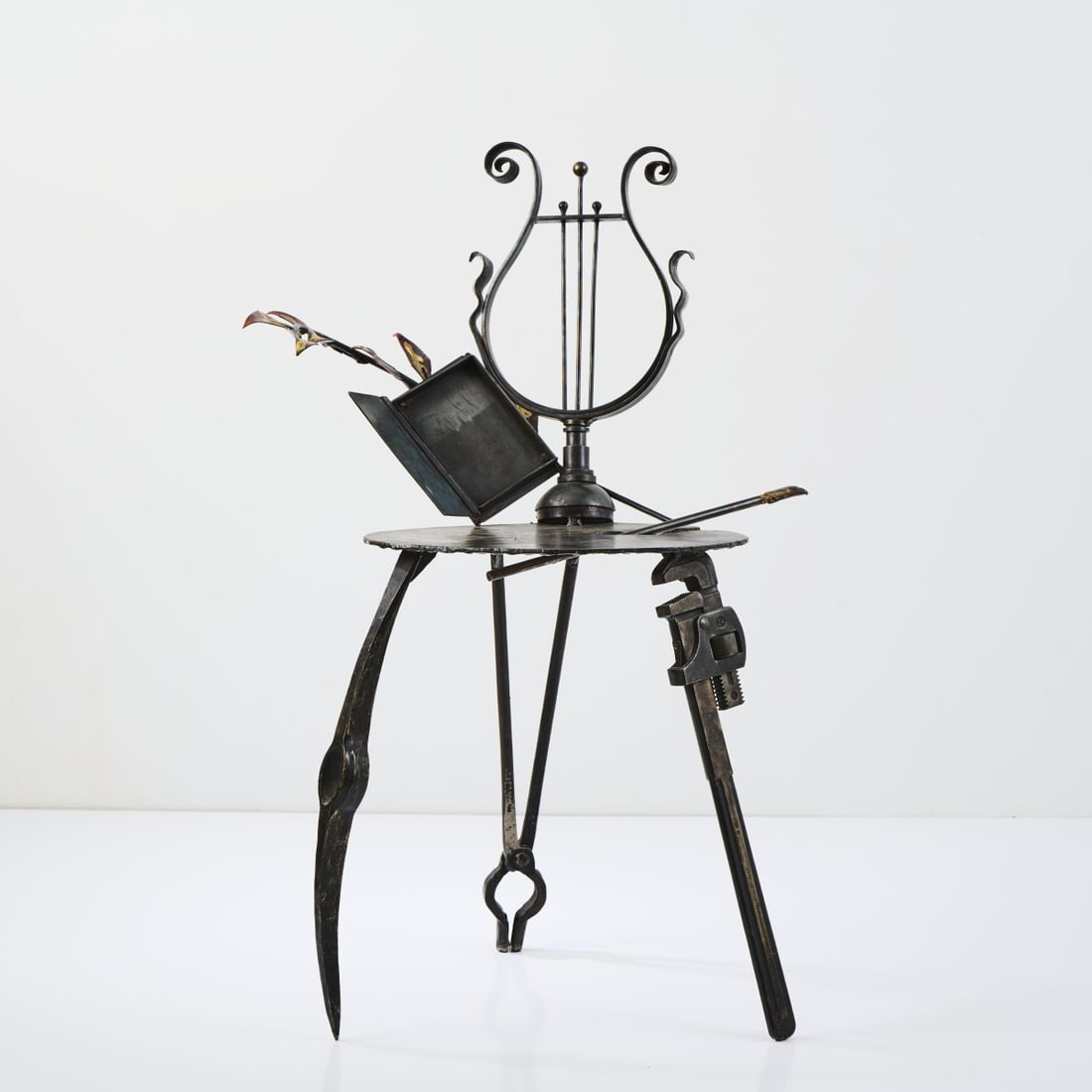 Mark Brazier-Jones, 'Lyre' chair, 1986 (design): H. 101 x 67 x 55.5 cm. Studio Mark Brazier-Jones, Buckland, Buntingford, 1989. Design welded together from various tools and steel profiles. Iron sheet, steel sheet, blackened, welded, copper sheet. M