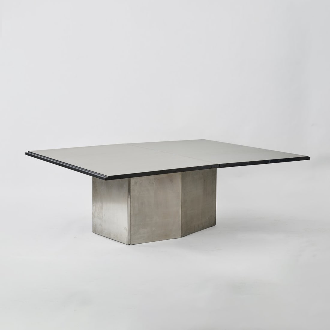 Cini Boeri, 'Folio' folding table, 1980: H. 80.5/84 x 199.5/149.5 x 150 cm. Rosenthal, Espelkamp. Stainless steel sheet, blockboard, painted black on one side, covered with metal sheet when opened. Marked inside on the serving trolley: manuf