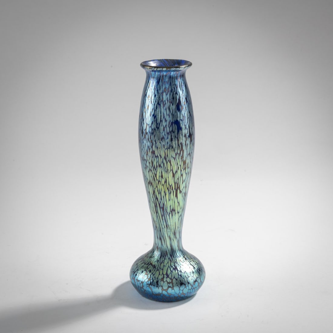 Loetz, Klastersky Mlyn, Slender 'Papillon' vase, c. 1899: H. 21 cm. Cobalt blue glass with silver-yellow fusions, papillon decoration, pearlescent matt luster.