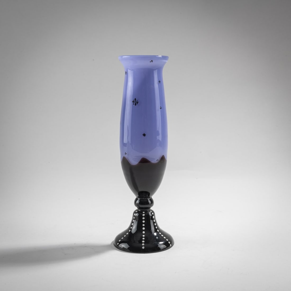 Loetz, Klastersky Mlyn, Slender Vase, c. 1920: H. 20 cm. Cased glass, colorless, opalescent light violet and deep violet. White enamel drops, black solder decoration in the style of Dagobert Peche.