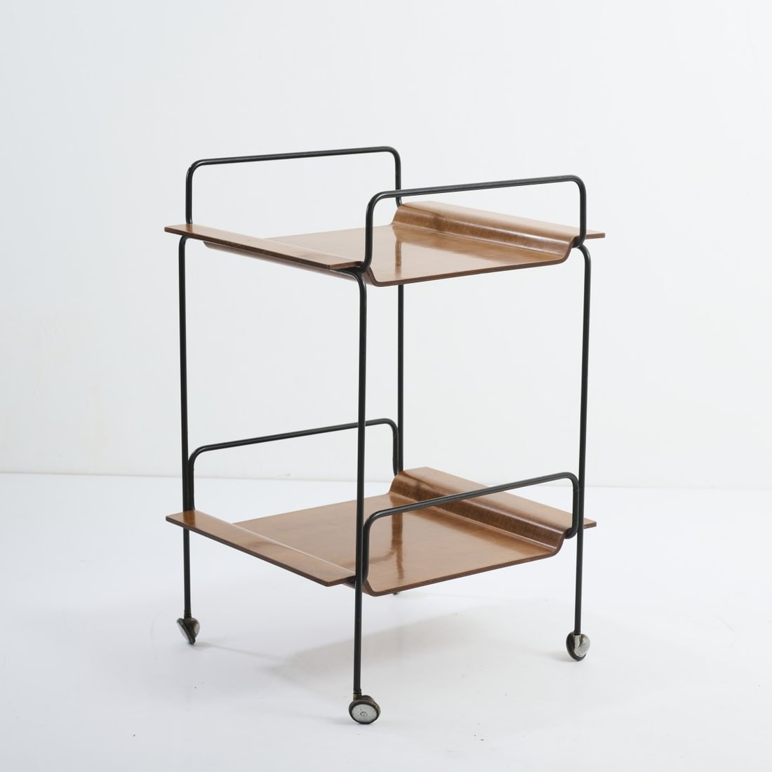 Carlo Graffi; Franco Campo (ATTR.), Serving trolley on wheels, 1960s: <p>H. 75.5 x 50.5 x 48 cm. <br />Home, Turin (ATTR.). <br />Metal rods, painted black, teak plywood. </p>