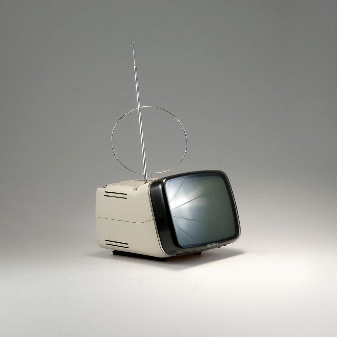 Marco Zanuso; Richard Sapper. 'Algol 11' TV-set, 1964. : Marco Zanuso; Richard Sapper. 'Algol 11' TV-set, 1964. H. 23 x 26 x 31 cm. Made by Brionvega, Milan. Grey plastic, smoke black perspex. Marked: BRIONVEGA, algol 11''.