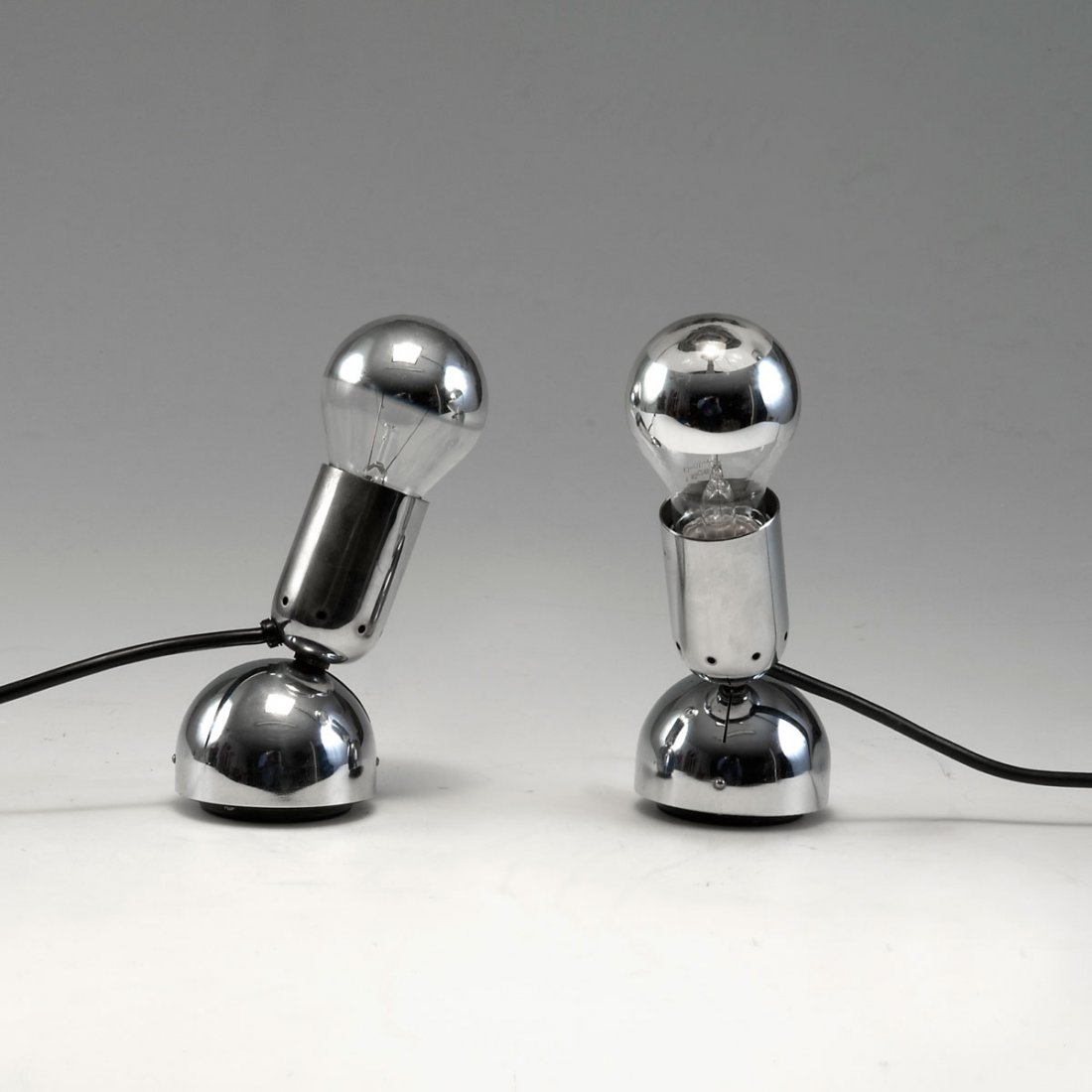 Ingo Maurer. 'Pollux' table light, 1967. H. 18.5 cm (ma: Ingo Maurer. 'Pollux' table light, 1967. H. 18.5 cm (max.). Made by Design M Ingo Maurer, Munich. Chrome-plated metal, black plastic.