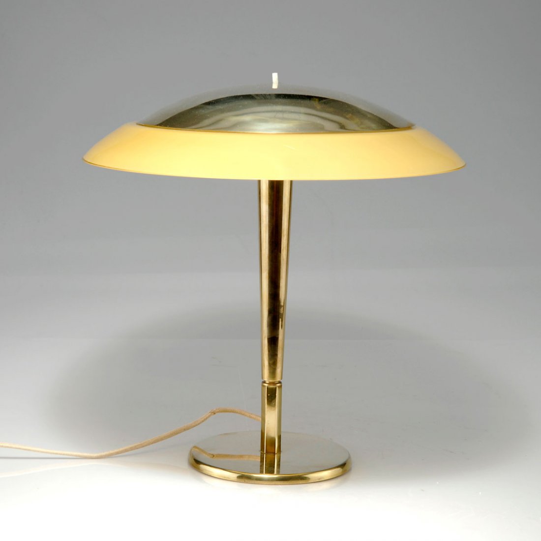 Paavo Tynell. Table light, 1938. H. 40.5 cm; D. 40 cm. : Paavo Tynell. Table light, 1938. H. 40.5 cm; D. 40 cm. Made by Taito Oy, Helsinki. Brass, glass, clear and yellow. Marked: V. TAITO.
