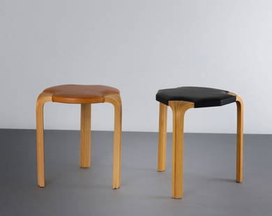 Alvar Aalto. Two X600' and 'X602' stools, 1954. H. 46 c: Alvar Aalto. Two X600' and 'X602' stools, 1954. H. 46 cm; D. 42-43 cm. Made by Artek, Helsinki. Plywood, ash wood, leather, brown resp. black.