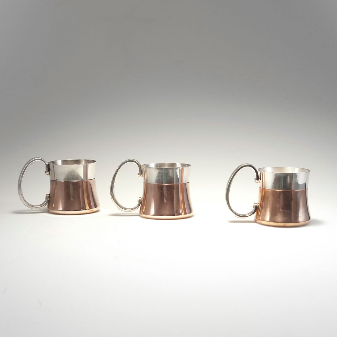 Henning Koppel. Three 'Master's tankards' from the 'Tav: Henning Koppel. Three 'Master's tankards' from the 'Taverna' set, c1960. H. 10.8 cm. Made by Georg Jensen, Copenhagen. Chrome-plated steel, copper-plated in parts. Marked: GEORG JENSEN DESIGN HK DENMA