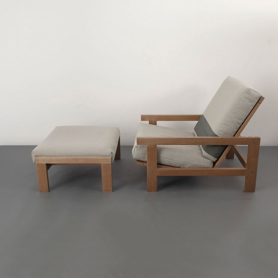 Hans J. Wegner. Easy chair and stool, c1967. Chair: H. : Hans J. Wegner. Easy chair and stool, c1967. Chair: H. 82 x 75.5 x 93 cm; stool: H. 35 x 74.5 x 63 cm. Made by Getama, Gedsted. Oak, green-beige fabric. Marked: Maker's and designer's data.