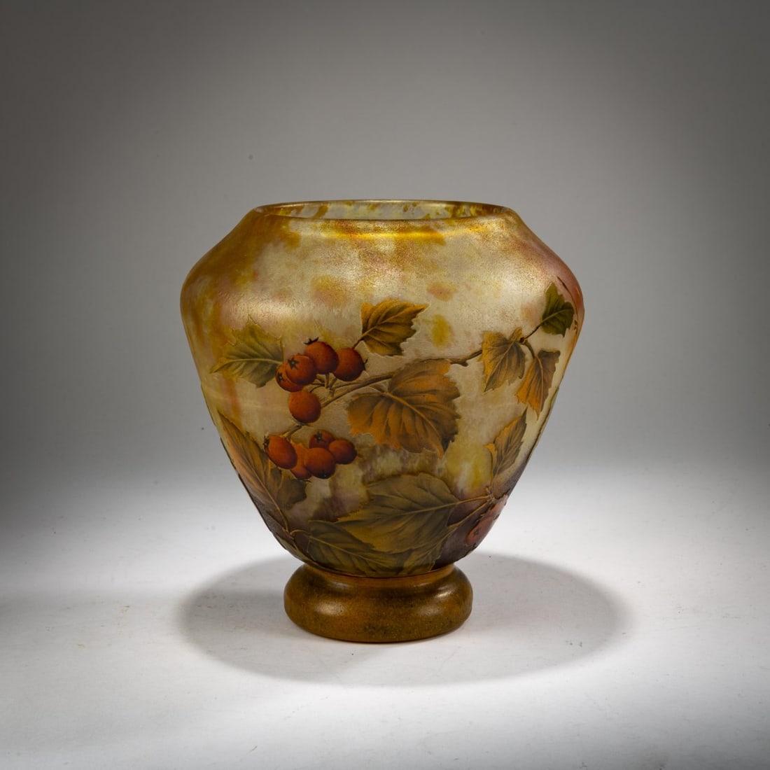 Daum Frères, Nancy, Vase 'Pommes d'api', 1905-10: <p>H. 19.5 cm. Cased glass, violet and orange powder inclusions, yellow, green and red enamel, black solder contours. Etched decoration with Rossdorf apples in a morning mood. Signed: DAUM NANCY