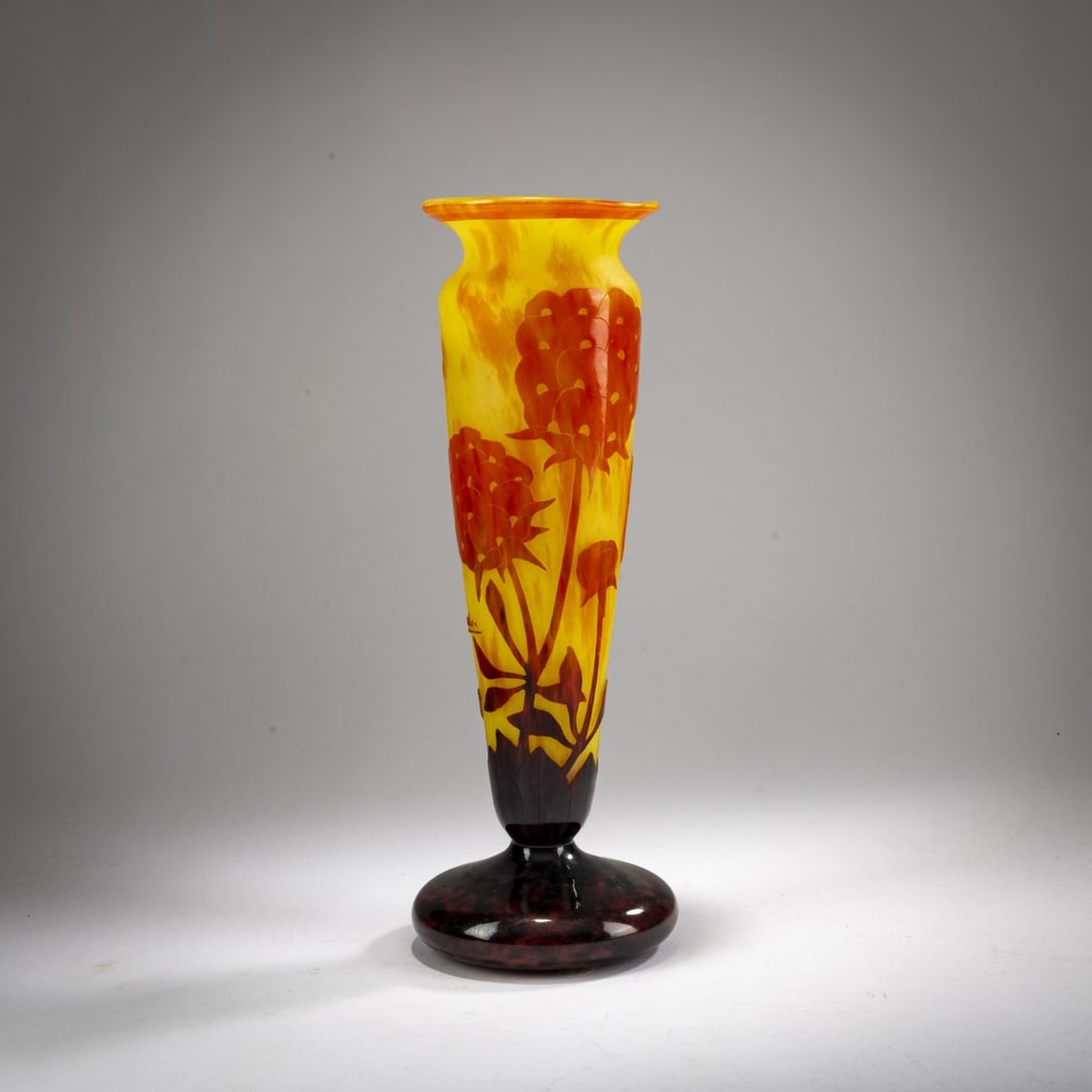 Schneider, Epinay-sur-Seine, Tall Vase 'Pivoines', 1927-28: <p>H. 29.9 cm. Cased glass, colorless with yellow and orange powder inclusions, orange and violet enamel fusions. Etched decoration with peonies. Wall signed: Charder (raised); foot signed: Le V