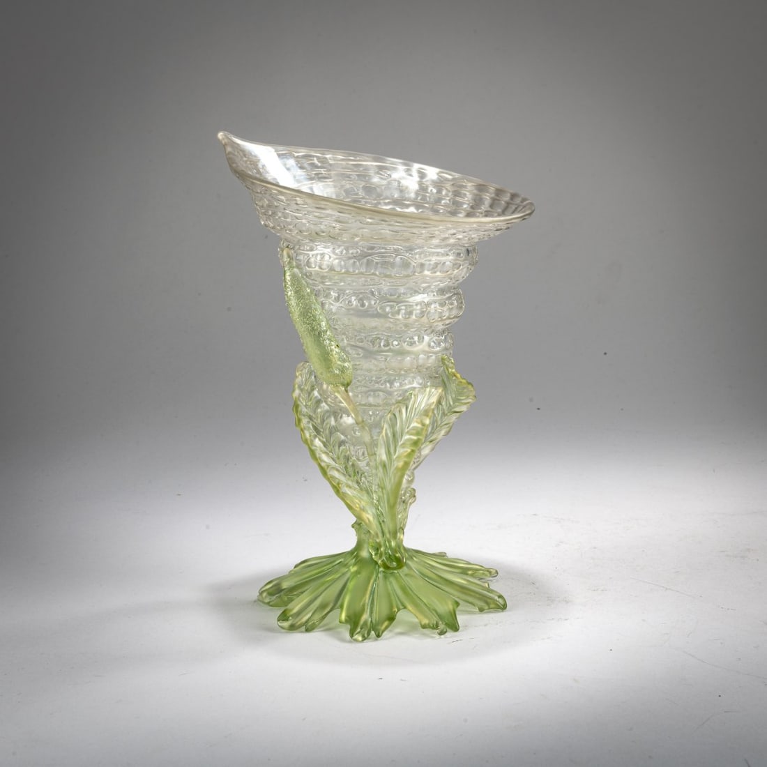 Loetz, Klastersky Mlyn, Shell vase 'Chrystal chiné', c. 1897/98: <p>H. 20.4 cm. Colorless and green glass, matt luster, fine mesh overlay, so-called Chin&eacute; decoration. Applied arrowhead. </p><hr><p>Literature:</p><p>Ric