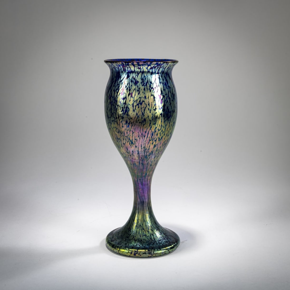 Loetz, Klastersky Mlyn, 'Papillon' goblet, c. 1899: <p>H. 24.8 cm. Cobalt blue glass with silver-yellow fusions, papillon decoration, pearlescent matte luster. </p>