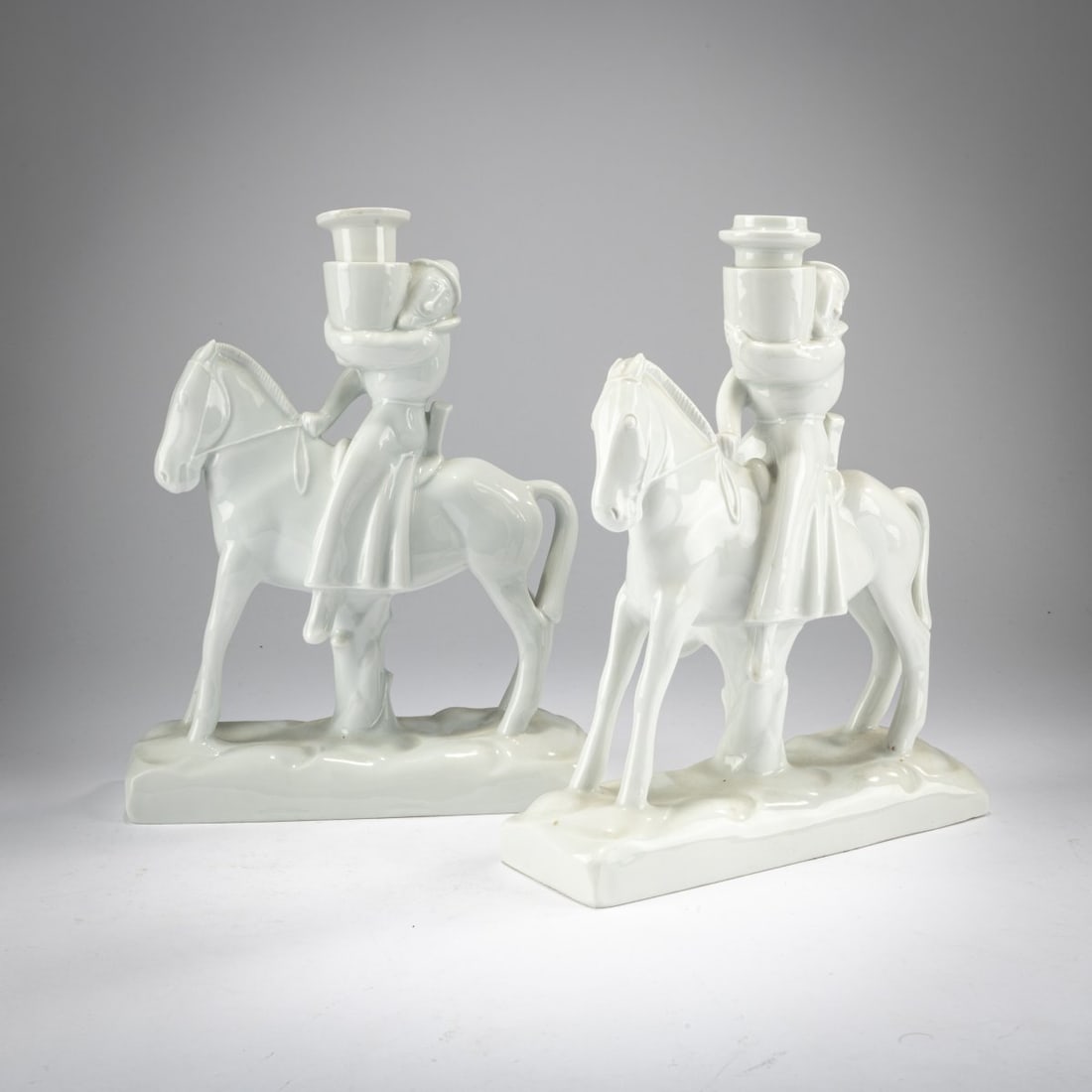 Gerhard Marcks, Two 'candle riders', 1918/19: <p>H. 22.8-23 cm. Execution: StPM Meissen, 1924-34. Porcelain, white, glazed. Marked: Pfeiffer mark (blue, underglaze, one with four strokes), white mark (stamped), A 1010 (incised), 50 or 131 (