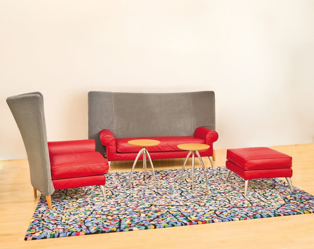 Philippe Starck, Armchair 'Royalton', 1988: <p>H. 116 x 98 x 100 cm. <br />Driade Aleph, Corsico, c. 1993. <br />Wooden frame construction, cast aluminum, cherry wood, red leather, blue-gray textile cover.</p><hr>&