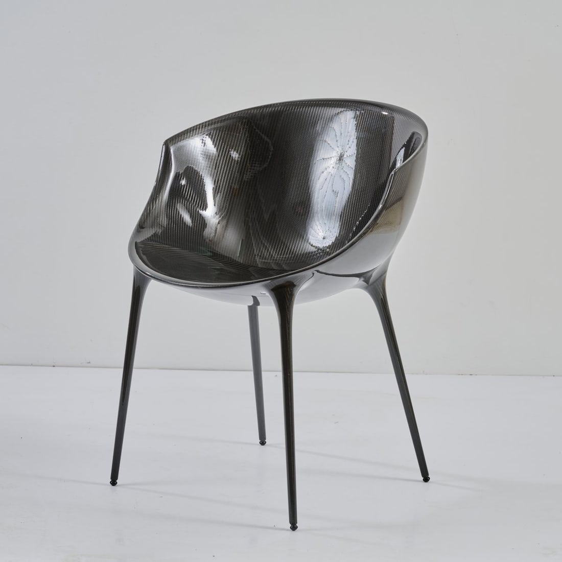 Philippe Starck, Armchair 'Oscar Bon', 2004: <p>H. 77 x 59.5 x 58 cm. <br />Driade, Corsico.<br />Carbon fibre, black. <br />Marked: Manufacturer's badge.</p>