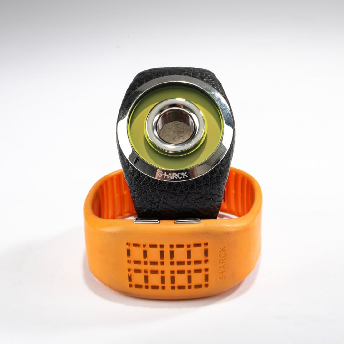 Philippe Starck , Two wristwatches 'PH-1057' and 'PH-1059', 2003: <p>L. 28 cm (open). <br />Fossil (Europe) GmbH, Grabenst&auml;tt. <br />Orange rubber, chrome-plated sheet steel, black leather. <br />Marked: Manufacturer's and designer's