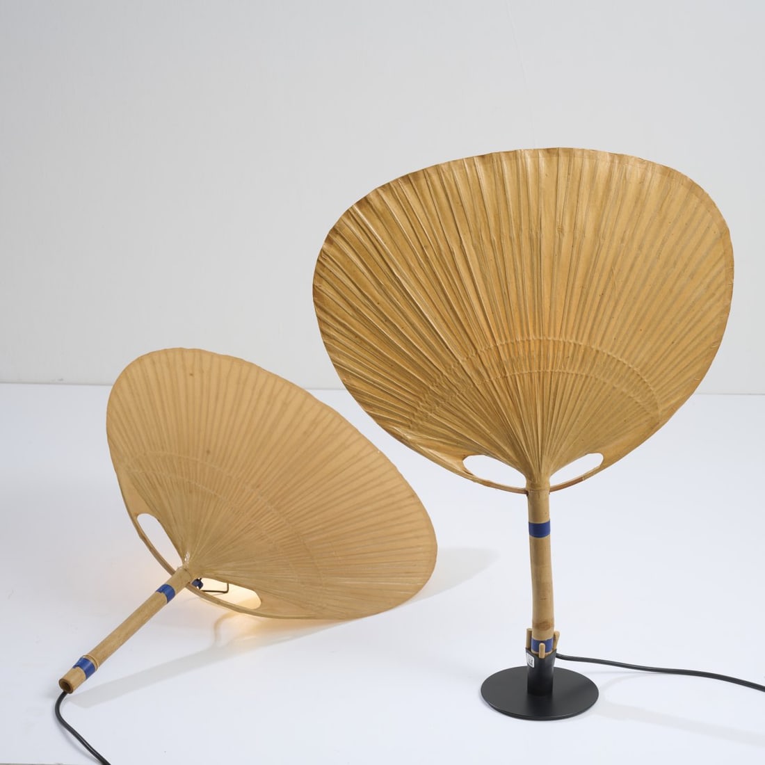 Ingo Maurer, Two wall lights 'Uchiwa III', 1973: <p>H. 74 cm. <br />Design M, Ingo Maurer, Munich. <br />Bamboo cane, rice paper. </p>