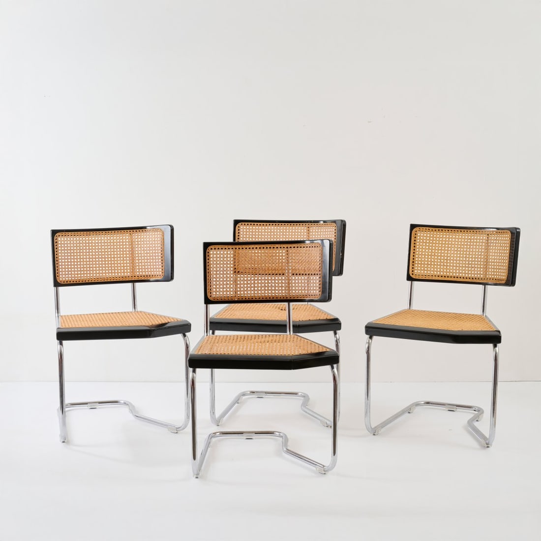 Stefan Wewerka , Four chairs 'B 2', 1982 (design): <p>H. 82 x 53.5 x 59 cm. <br />Tecta, Lauenf&ouml;rde, 1980s. <br />Chrome-plated tubular metal beechwood, painted black, wickerwork. Marked with makers sticker.</p>
