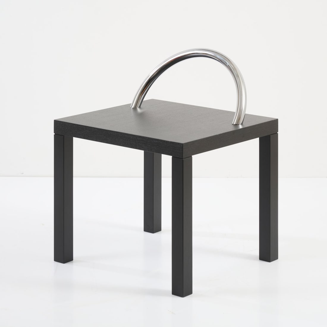 Shiro Kuramata , Side table / stool 'Ko-Ko', 1986 (design): <p>H. 61 x 50 x 45 cm. <br />Cappellini, Milan. <br />Black-stained ash wood, chrome-plated tubular metal. <br />Marked: Manufacturer's sticker.</p>