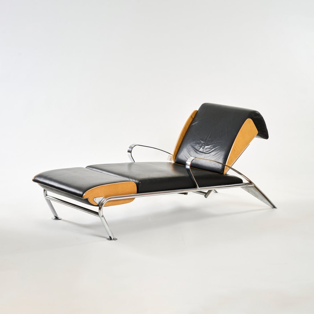 Massimo Iosa Ghini, 'Futuro 3' chaiselongue, 1987: <p>H. 78 x 68 x 190-214 cm. <br />Moroso, Tavagnacco <br />Metal tube and strip metal, chrome-plated, plywood with ash veneer, black leather.</p><hr><p>Literature:&