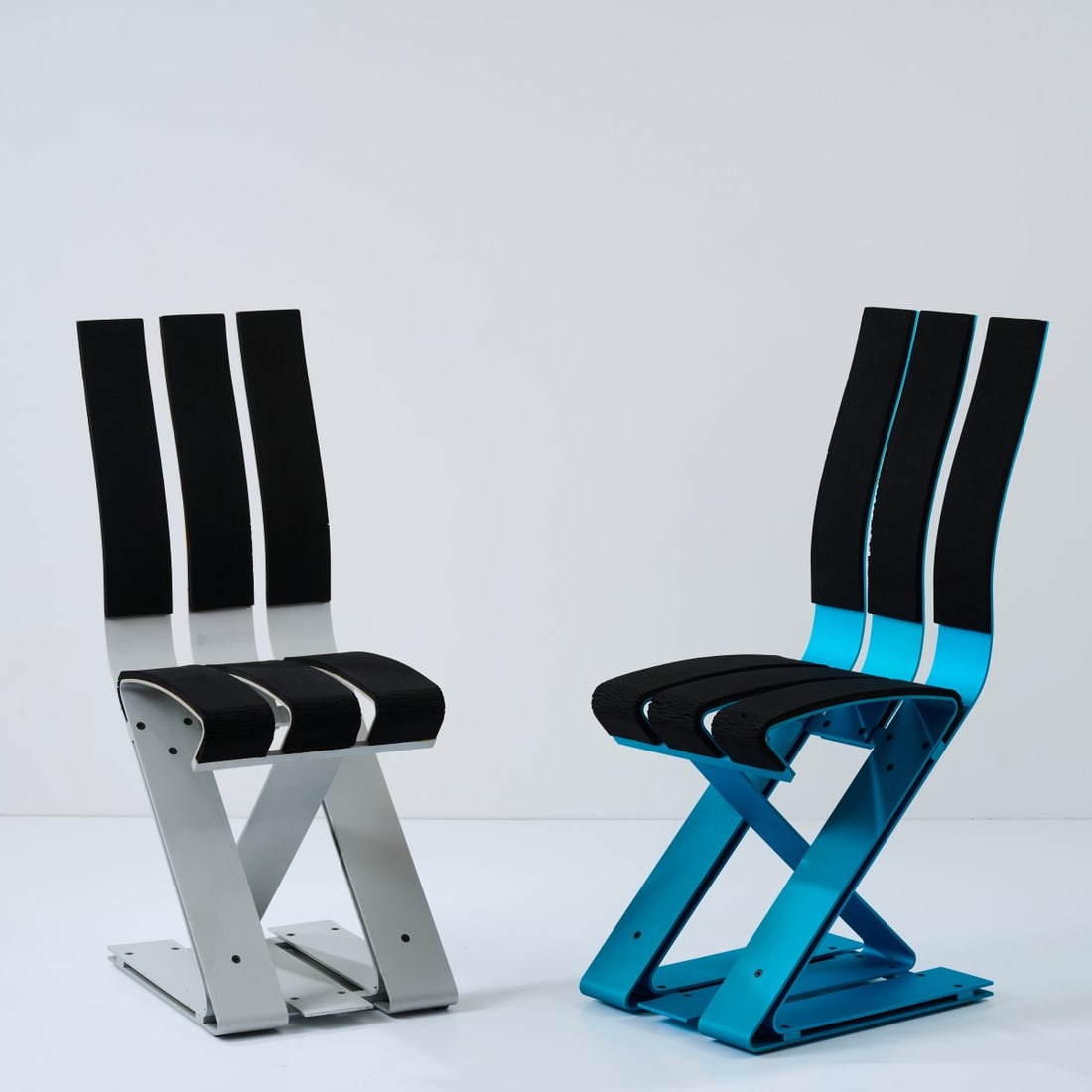 Ron Arad, Two 'School chairs', 1988: <p>H. 92.5 - 93.5 x 35 x 48 cm. <br />Vitra, Birsfelden. <br />Blue anodized and silver-colored sheet aluminum, black neoprene.</p><hr><p>Literature:</p><p