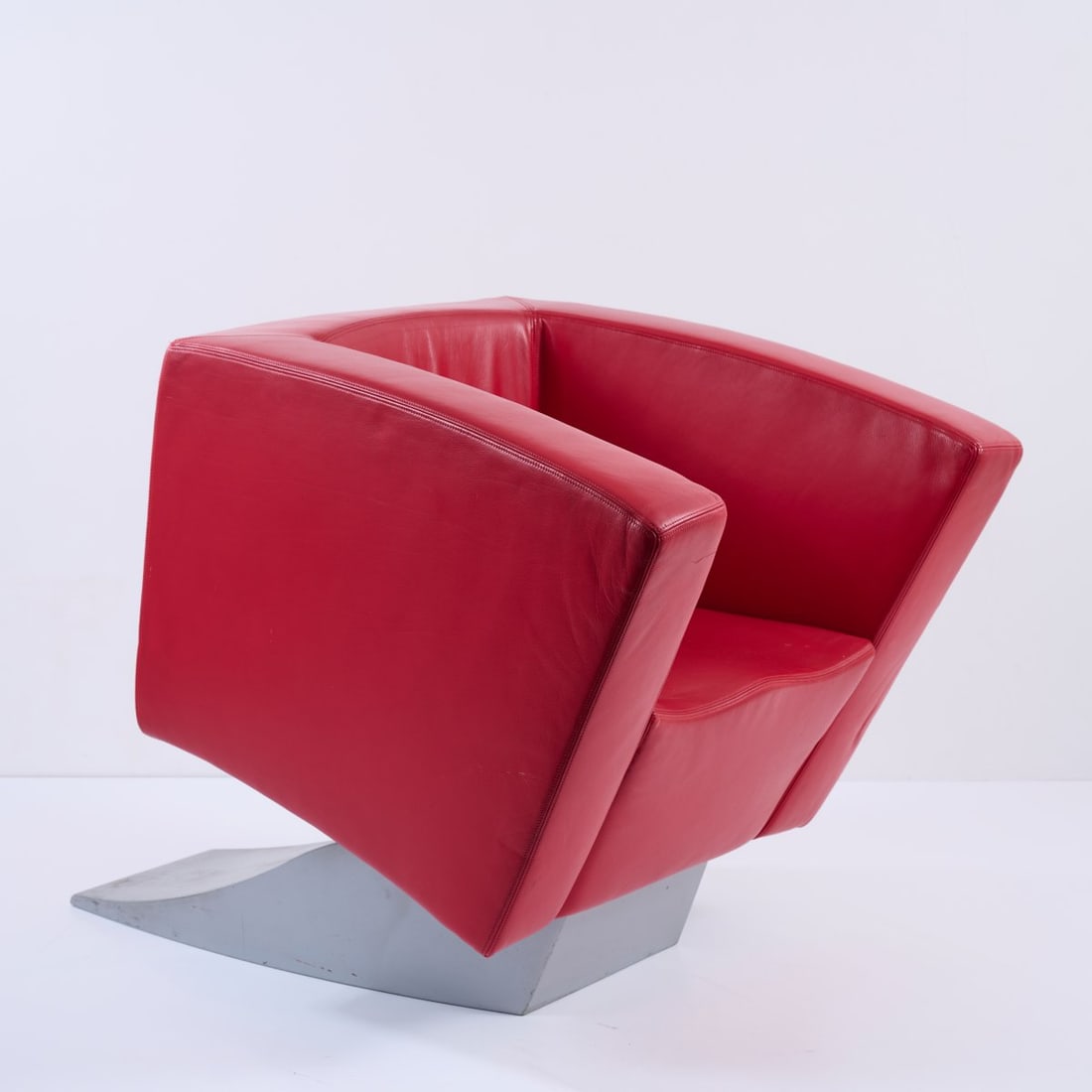 Ron Arad, Armchair 'Low Tilt' from the 'Spring Collection', 1990: <p>H. 78.5 x 83 x 119 cm. <br />Moroso, Tavagnacco. <br />Sheet metal, lacquered silvergray, red leather.</p><hr><p>Literature:</p><p>Sudjic, Ron Arad,