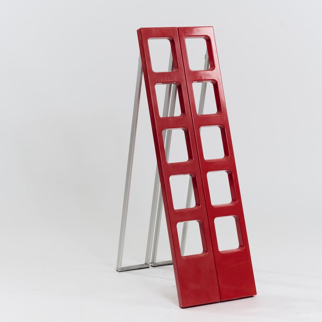 L & O Design; Roberto Lucci; Paolo Orlandini, Library ladder 'Scaleo', 1974 (design): <p>H. 131 x 20 x 8 cm; unfolded: H. 124 x 40 x 67 cm. <br />Velca, Milan.<br />Plastic, red, aluminum, stainless steel. <br />Marked: Manufacturer and designer's information (e