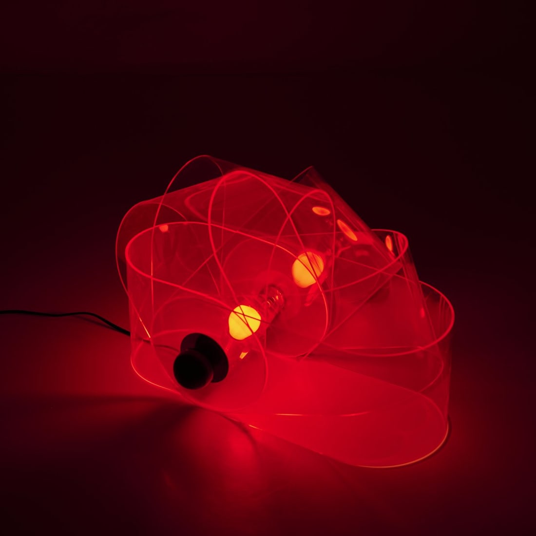 Superstudio; Adolfo Natalini; Cristiano Toraldo di Francia; Roberto Magris; Piero Frassinelli;: <p>H. 42 cm (max.). <br />Poltronova, Pistoia. <br />Chrome-plated sheet metal, neon red plastic, black plastic. <br />Marked: Poltronova manufacturer's label. </p><hr