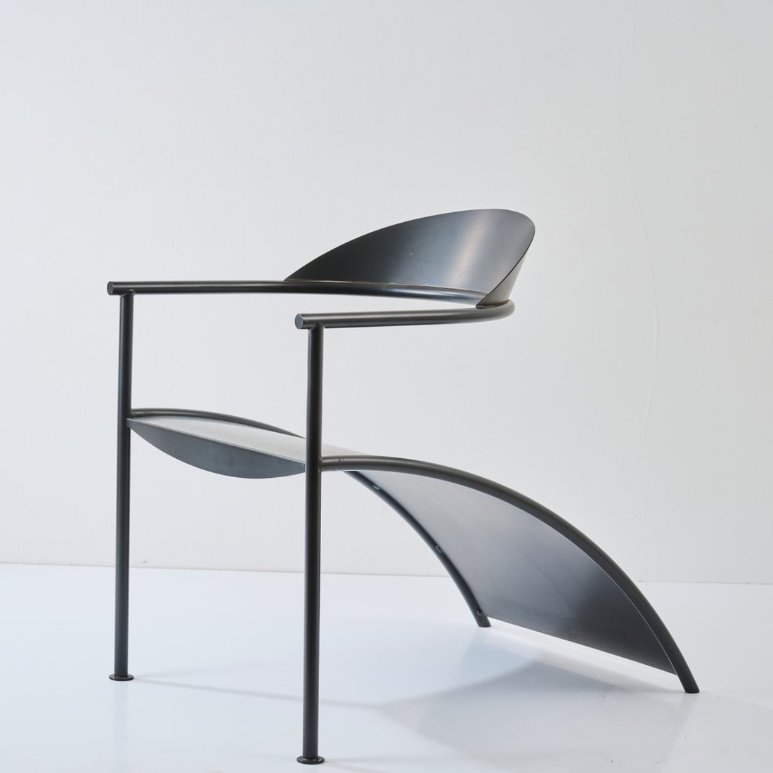 Philippe Starck, Armchair 'Pat Conley II', 1986 (design): <p>H. 75 x 54 x 76 cm. <br />XO, Paris. <br />Tubular metal, sheet metal painted dark gray.<br />Marked: Manufacturer's mark (raised).</p><hr><p>Literature:&l