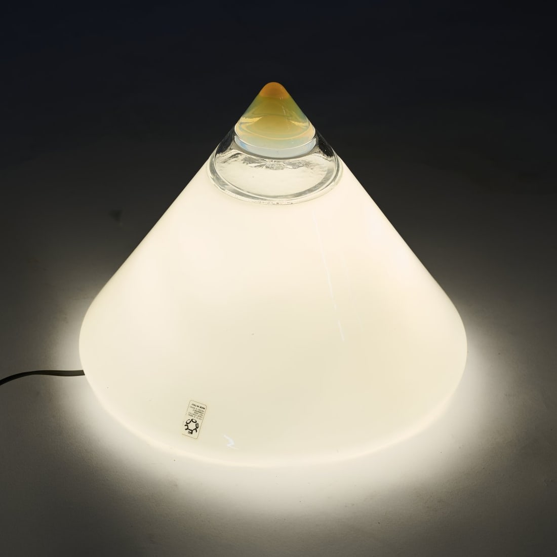 Giusto Toso , Table light 'Rio', 1960s: <p>H. 30 cm, &Oslash; 36 cm. <br />Leucos, Milan. <br />Glass, colorless, yellow, opaque white and opal white. <br />Marked: Manufacturer's label and embossing. </p>