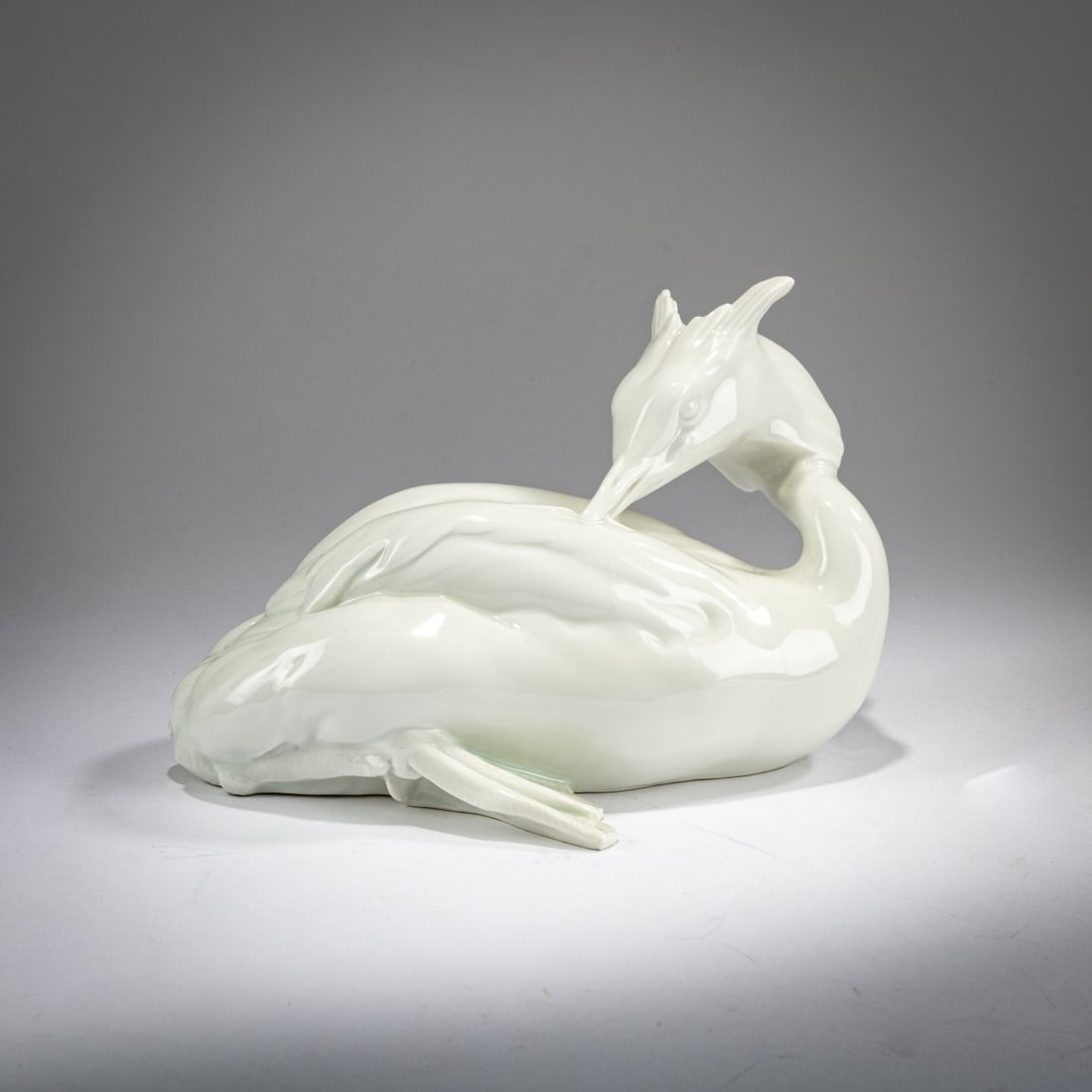 Paul Zeiller, 'Great Crested Grebe', 1912: <p>H. 13.6 cm. Execution: StPM Meissen, 1934-45. White glazed porcelain. Bottom marked: Swords (blue, under glaze, one stroke), W 270 (incised), 76 (embossed).</p>