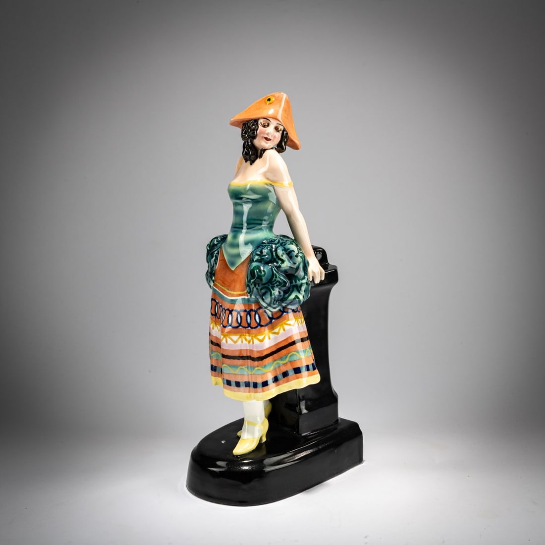 Josef Lorenzl, 'Standing young lady in carnival costume', c. 1925: <p>H. 34.8 cm. Execution: Friedrich Goldscheider, Vienna. Earthenware, polychrome glaze. Base signed: Lorenzl (embossed). Bottom marked: MADE IN AUSTRIA, Goldscheider Wien, Hand-Decorated (black