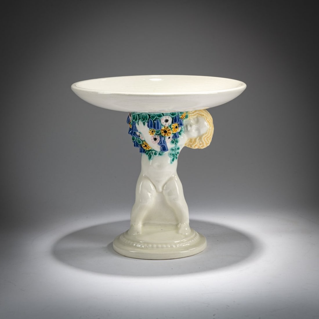 Michael Powolny, Bowl with putto, c. 1907: <p>H. 21.2 cm, &Oslash; 21.7 cm. Execution: Wiener Keramik. Earthenware, polychrome glaze on white. Bottom marked: Signet of Wiener Keramik, artist's signet. </p><hr><p>Lit