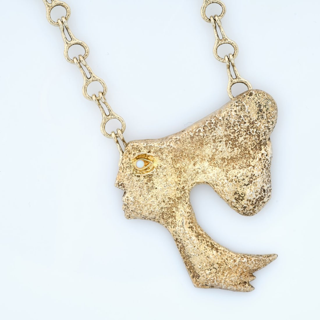 Georges Braque (after), Pendant 'Atalante' with chain 'Mesopotamia', circa 1963 (design): <p>Sterling silver, gold-plated, opal cabochon. <br />36.04 grams. Pendant 61 x 54 mm, chain length 380 mm. <br />Made by Cas Bernard, 1990s. <br />Stamped: BC, 925, Bijoux de