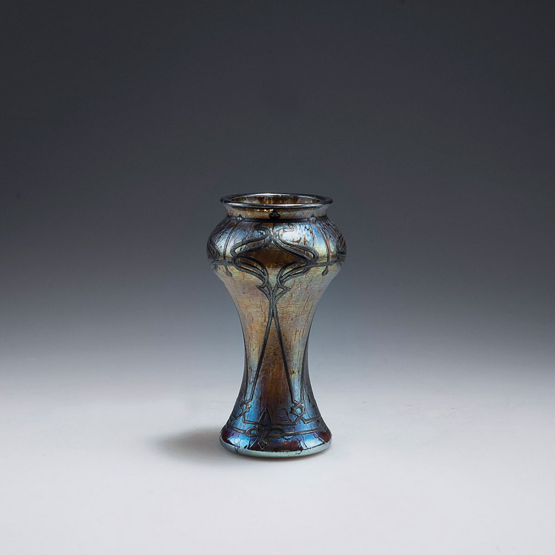'Papillon' vase with galvanic silver overlay, c1900: Loetz Wwe., Klostermuehle. 'Papillon' vase with galvanic silver overlay, c1900. H. 12.8 cm. Clear glass, Papillon pattern, matt mother of pearl lustre. Engraved silver overlay.