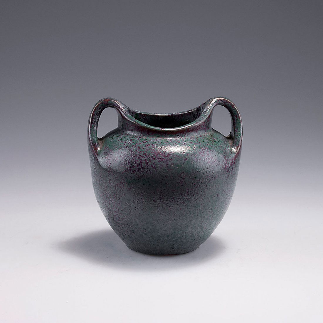 Small vase with handles, c1905: Edmond Lachenal, Paris. Small vase with handles, c1905. H. 11.5 cm. Earthenware, green glaze on dark red. Marked: LACHENAL, 3.