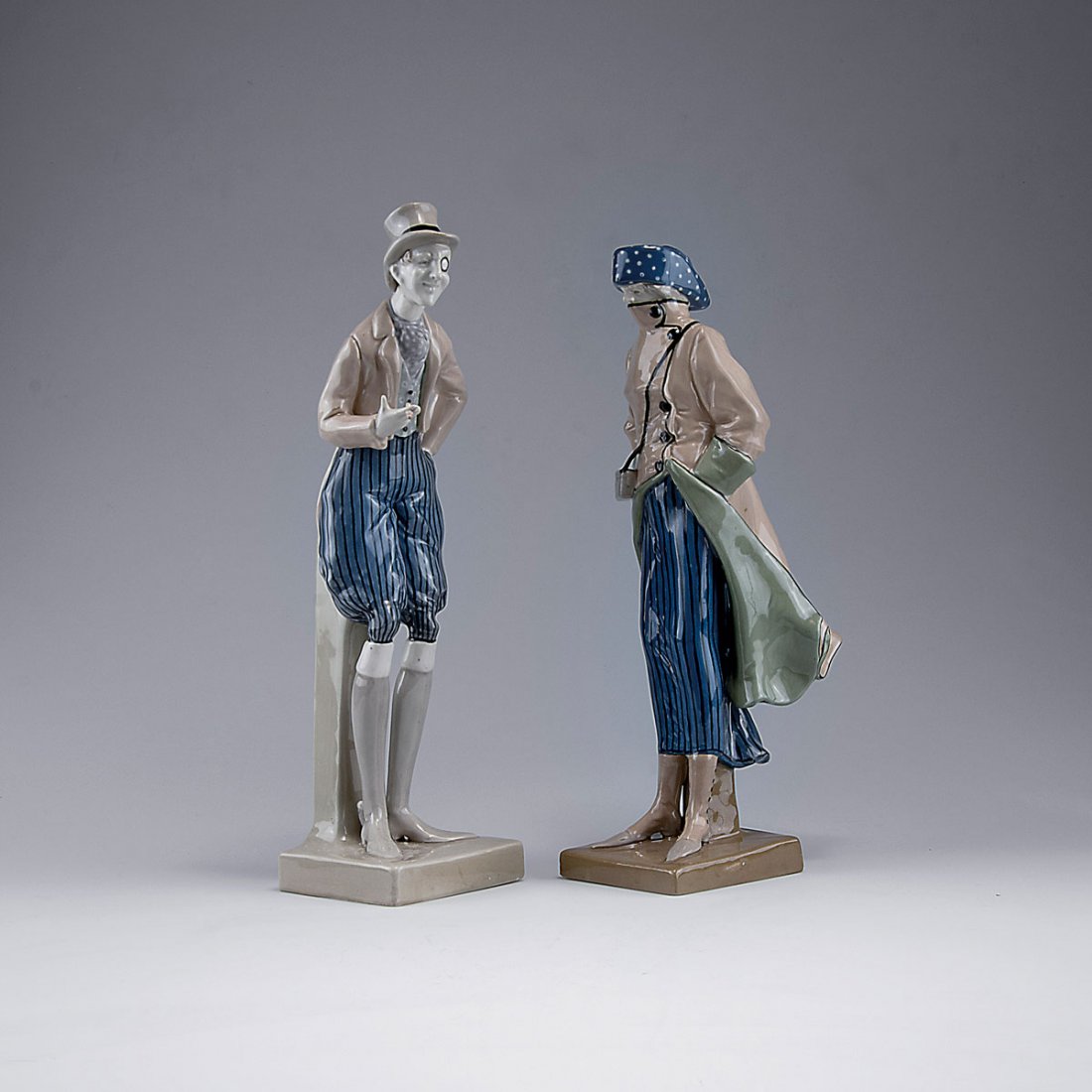 Pair of figurines, c1906: Amphora-Werke Riessner & Kessel, Turn-Teplitz. Pair of figurines, c1906. Woman, H. 36.6 cm; man, H. 38.9 cm. Earthenware, polychromatic glaze. Marked: Imperial Amphora, Austria, 5087, 46 resp. Imperia