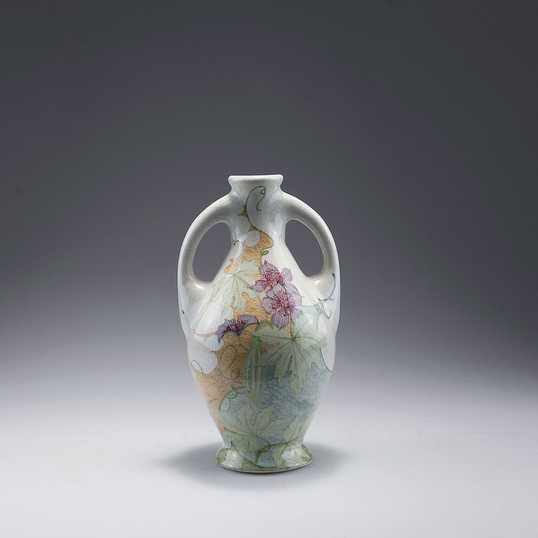 Vase with handles, 1906-17: Plateelbakkerij Zuid-Holland E. Estie & Co., Gouda. Vase with handles, 1906-17. H. 25.9 cm. Earthenware, polychromatic glaze, clematis pattern. Marked: MADE IN ZUID HOLLAND, Lazarus gate, P/B, E. D. (