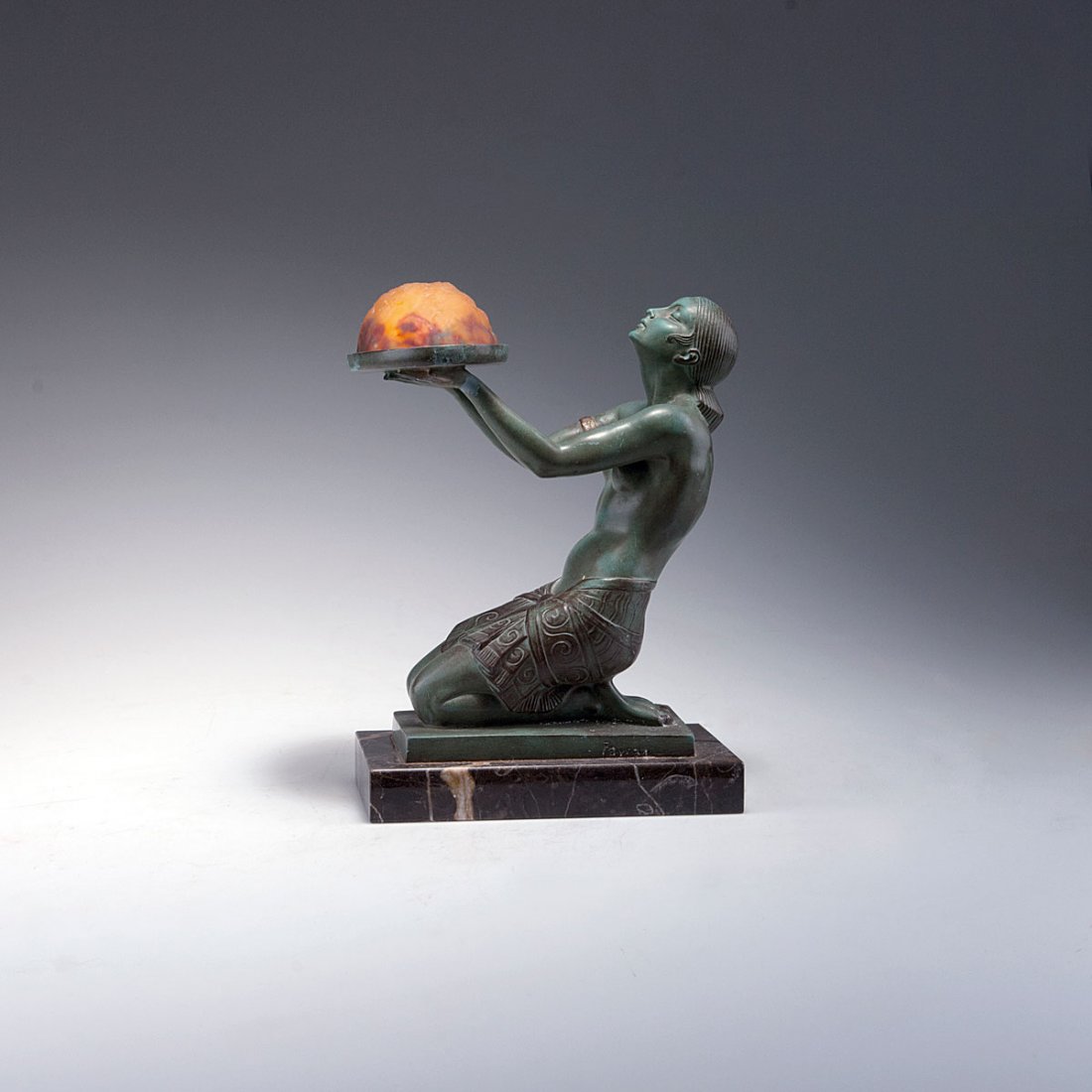 Table light with shade by Daum Frres, c1930: Pierre Le Faguays, Paris. Table light with shade by Daum Freres, Nancy, c1930 H. 28.8 cm; 21.2 x 14.1 cm. Bronze with green patina, glass, clear and orange, red, yellow and green powder inclusion. Rel