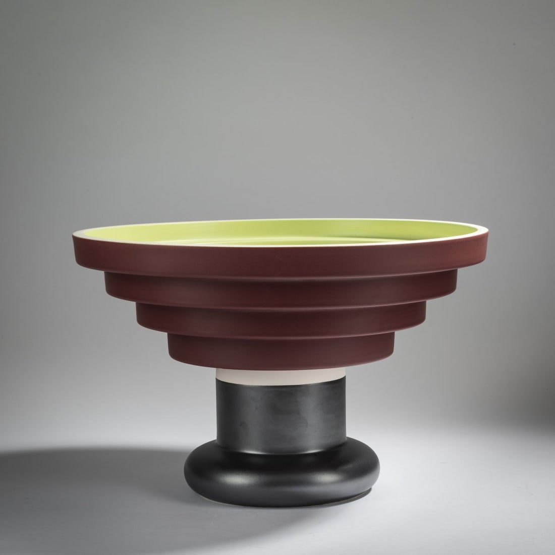 Ettore Sottsass, Footed bowl 'Alzata a scalino' - 540', 1956 (design): <p>H. 24 cm, &Oslash; 39 cm. <br />Bitossi, Montelupo. <br />Earthenware, glazed in lime green, raspberry red, white and metallic gray. <br />Marked: E. Sottsass Bitossi -