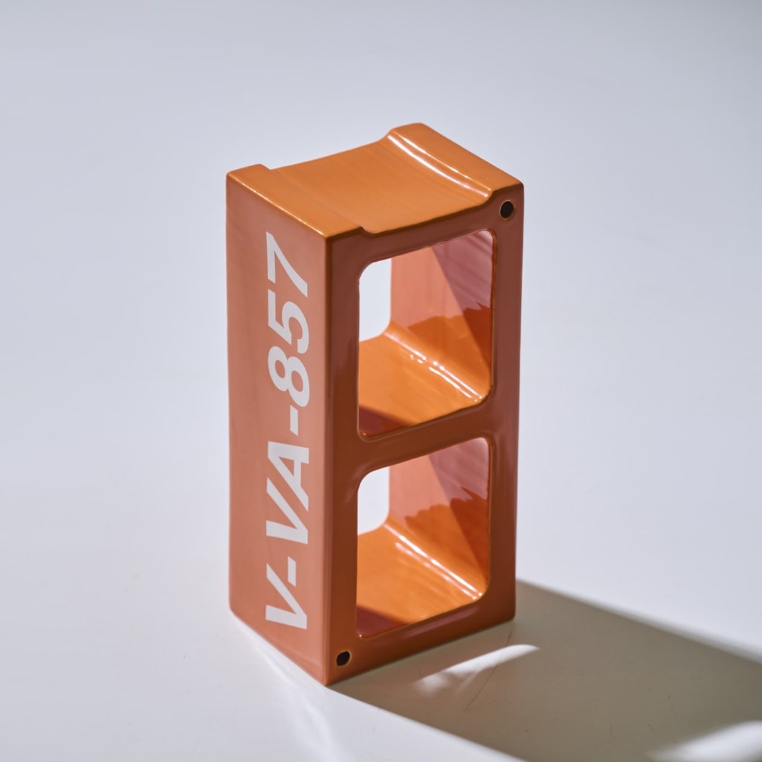 Virgil Abloh , Ceramic Block 'V-VA-675', 2019: <p>H. 10.5 x 28.5 x 14 cm. <br />Vitra, Birsfelden. <br />Earthenware, glazed orange and white.<br />Marked: V-VA-857, Manufacturer and designer's info (raised). </p>