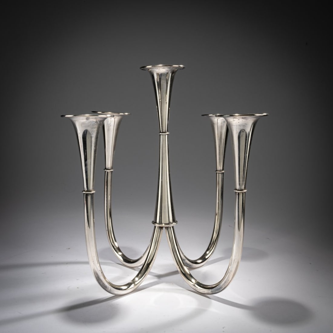 Wilhelm Wagenfeld, Five-flame candlestick, 1952/53: <p>H. 28.5 cm, 29.5 x 30.5 cm. <br />WMF, Geislingen. <br />Silver-plated brass.</p><hr><p>Literature:</p><p>Manske, Wilhelm Wagenfeld (1900 - 1990),