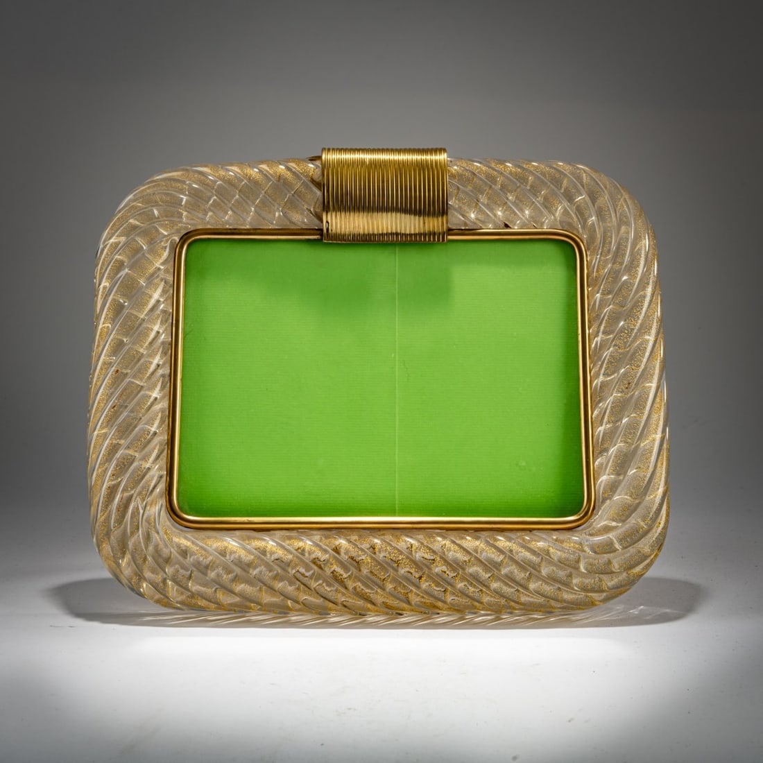 Barovier & Toso, Murano (attributed) , Stand frame, c. 1950: <p>26 x 31.5 cm. <br />Colorless glass with gold glitter inclusions, brass sheet, brass casting. </p>