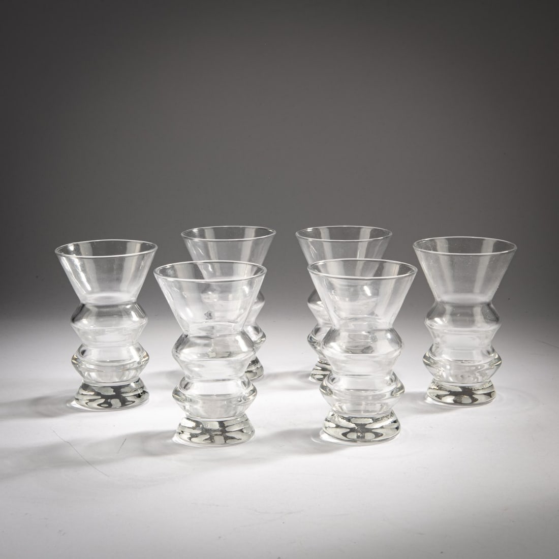 Atelier Alchimia, Six water glasses, c. 1985: <p>H. 12.1 cm. <br />Alchimia, Milan. <br />Colorless glass, matte-cut base. </p>