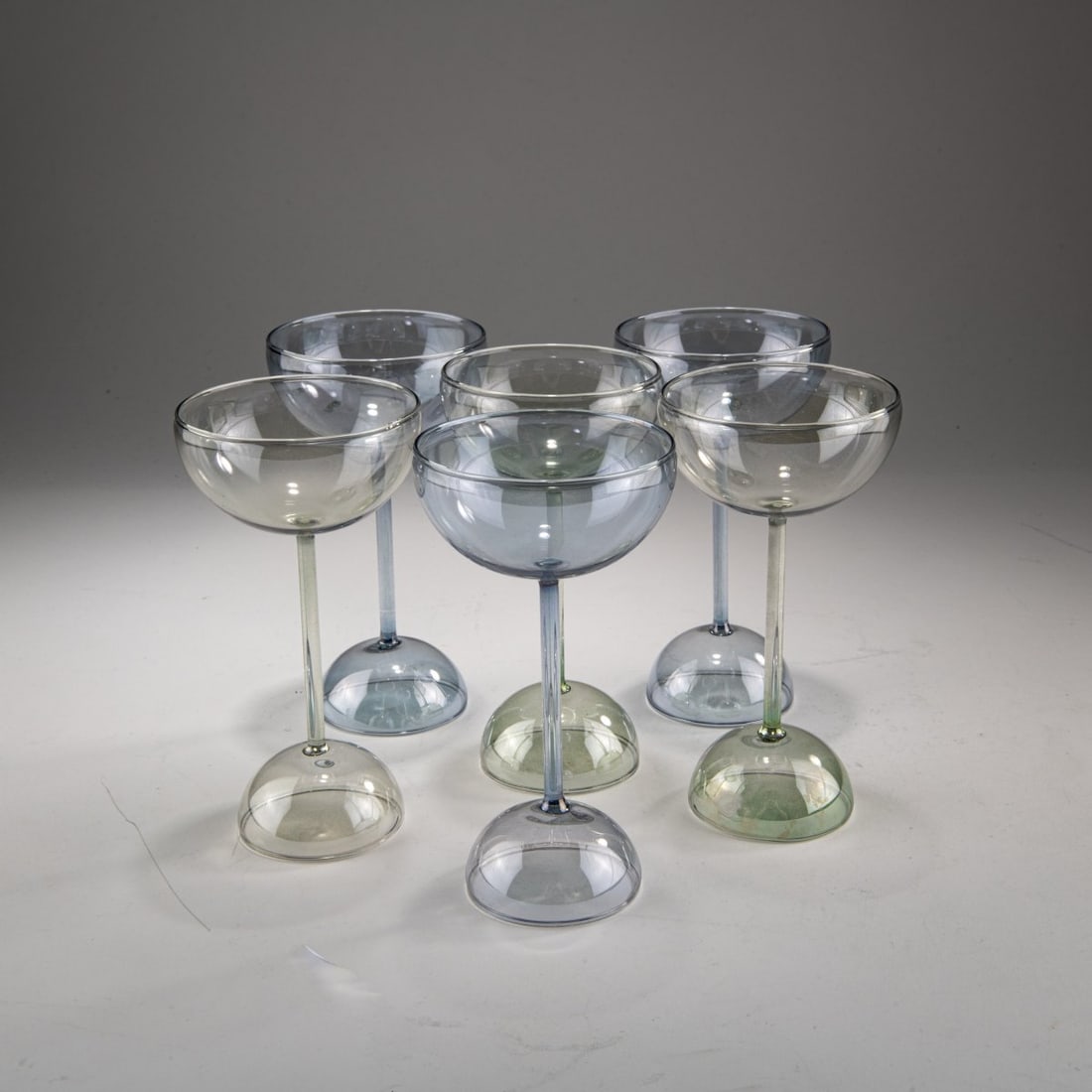 Alessandro Mendini, Six 'Ollo' glasses, 1988: <p>H. 15 cm. <br />Alchimia, Milan. <br />Colorless glass, slightly bluish and green, iridescent. </p><hr><p>Literature:</p><p>Cat. Alchimia. Die