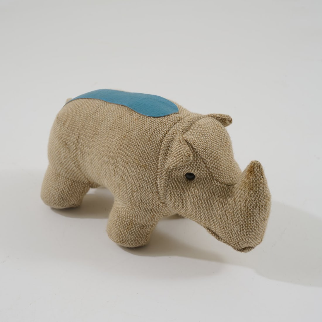 Renate Müller, Therapeutic toy Rhino, c. 1968: <p>H. 18.5 x 17 x 34 cm. <br />H. Josef Leven KG, Sonneberg. <br />Burlap, blue leather. </p><hr><p>Literature:</p><p>Exh. cat. Renate M&uuml;ller