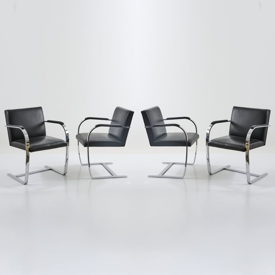 Ludwig Mies van der Rohe , Four 'Brno' armchairs, 1929/30 (design): <p>H. 79 x 58 x 60 cm. <br />Knoll International, New York, 1990s. <br />Sectional steel, chrome-plated, black leather.