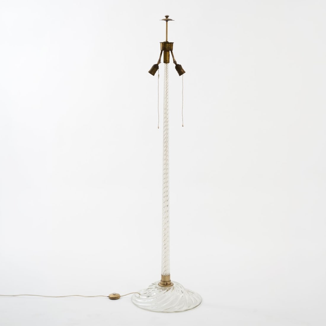 Paolo Venini , Floor lamp 'Cordonato', c. 1935: <p>H. 168 cm.<br />Venini, Murano. <br />Colorless glass, spiral, brass tube, brass sheet. <br />Marked: Remnants of a manufacturer's label.</p>